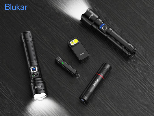 A collection lineup of five different black Blukar rechargeable LED flashlights on a dark wooden background, showcasing various sizes, digital battery displays, and adjustable focus tactical designs.